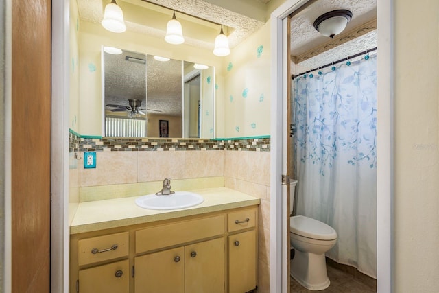 6831 Greenwich Ave, New Port Richey, FL 34653 - bathroom with vanity, toilet, a textured ceiling, visible vents, and a ceiling fan