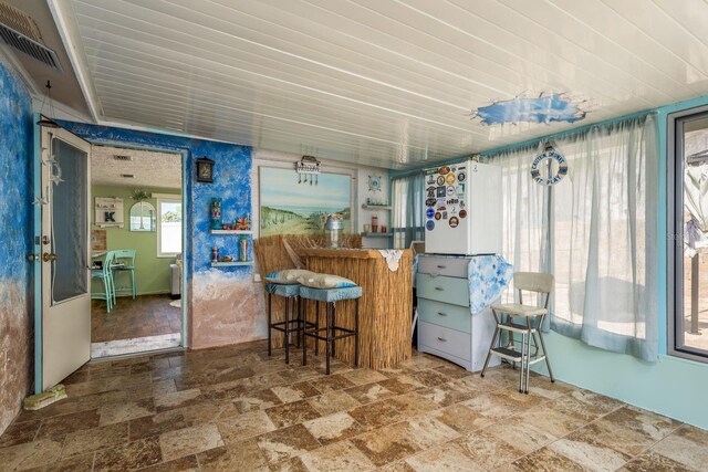 6831 Greenwich Ave, New Port Richey, FL 34653 - kitchen featuring stone finish floor and visible vents