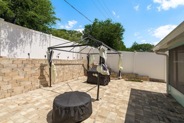 6831 Greenwich Ave, New Port Richey, FL 34653 - view of patio / terrace featuring a fenced backyard, a gazebo, and grilling area