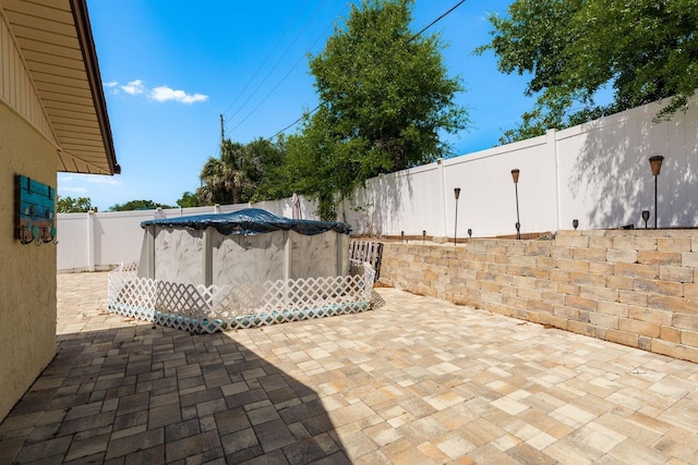 6831 Greenwich Ave, New Port Richey, FL 34653 - view of patio / terrace featuring a fenced backyard and a fenced in pool