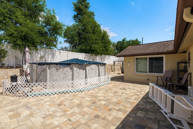 6831 Greenwich Ave, New Port Richey, FL 34653 - view of patio featuring a fenced backyard and a fenced in pool