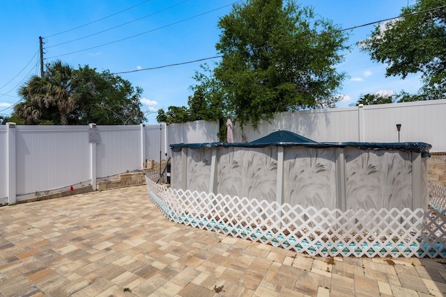 6831 Greenwich Ave, New Port Richey, FL 34653 - view of swimming pool with a fenced backyard, a covered pool, and a patio area