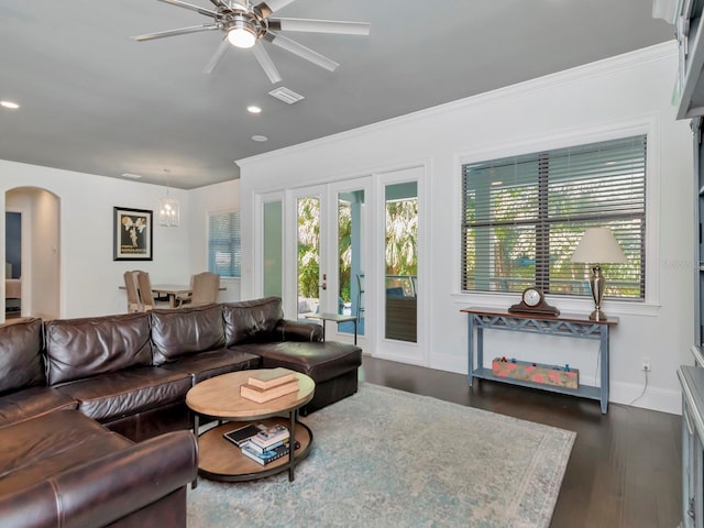 150 Chippewa Ave, Tampa, FL 33606 - living area featuring arched walkways, ceiling fan, visible vents, and a healthy amount of sunlight