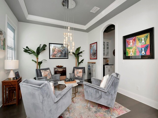 150 Chippewa Ave, Tampa, FL 33606 - living area featuring ornamental molding, arched walkways, a tray ceiling, and visible vents