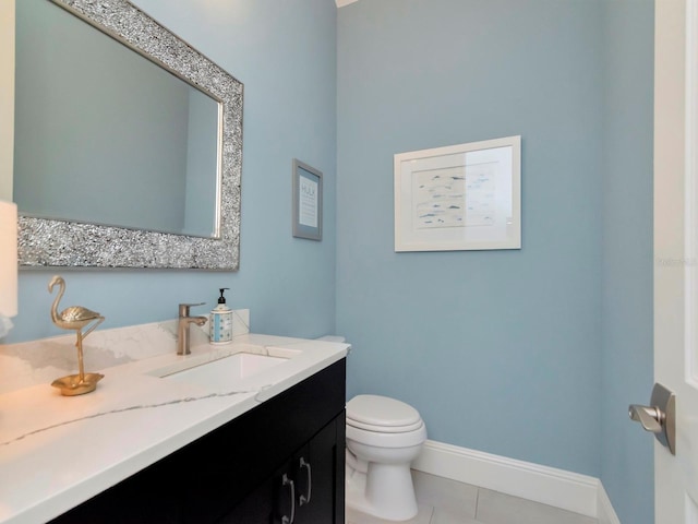 150 Chippewa Ave, Tampa, FL 33606 - bathroom featuring baseboards, toilet, tile patterned flooring, and vanity