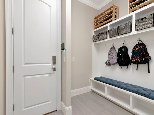 150 Chippewa Ave, Tampa, FL 33606 - mudroom with crown molding, baseboards, and wood finished floors