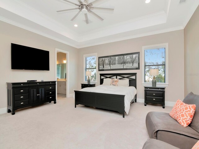 150 Chippewa Ave, Tampa, FL 33606 - bedroom with ensuite bathroom, baseboards, ornamental molding, light carpet, and a tray ceiling