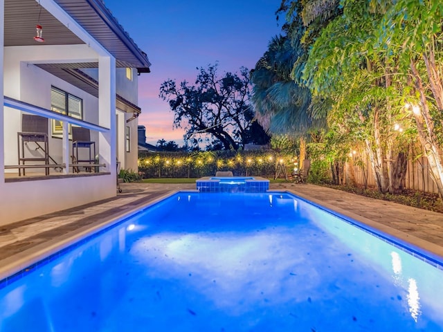 150 Chippewa Ave, Tampa, FL 33606 - view of swimming pool with a pool with connected hot tub and a patio