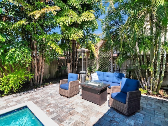 150 Chippewa Ave, Tampa, FL 33606 - view of patio / terrace with a fenced backyard, a fenced in pool, and an outdoor living space with a fire pit