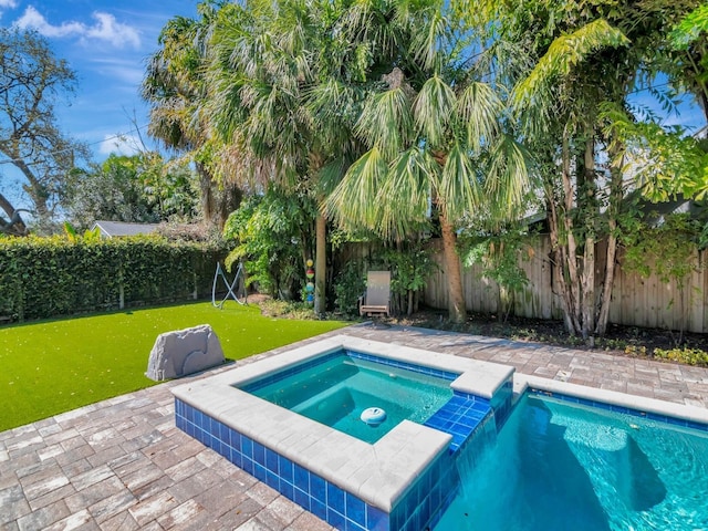 150 Chippewa Ave, Tampa, FL 33606 - view of pool featuring a fenced backyard, a yard, and a patio
