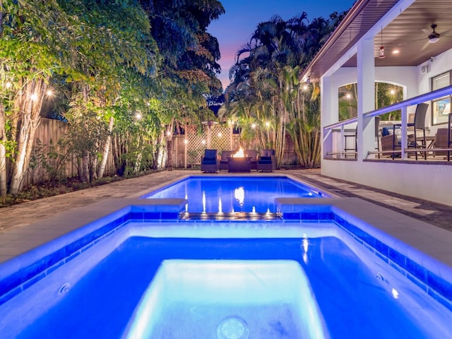 150 Chippewa Ave, Tampa, FL 33606 - view of swimming pool featuring ceiling fan, a fenced backyard, and an in ground hot tub