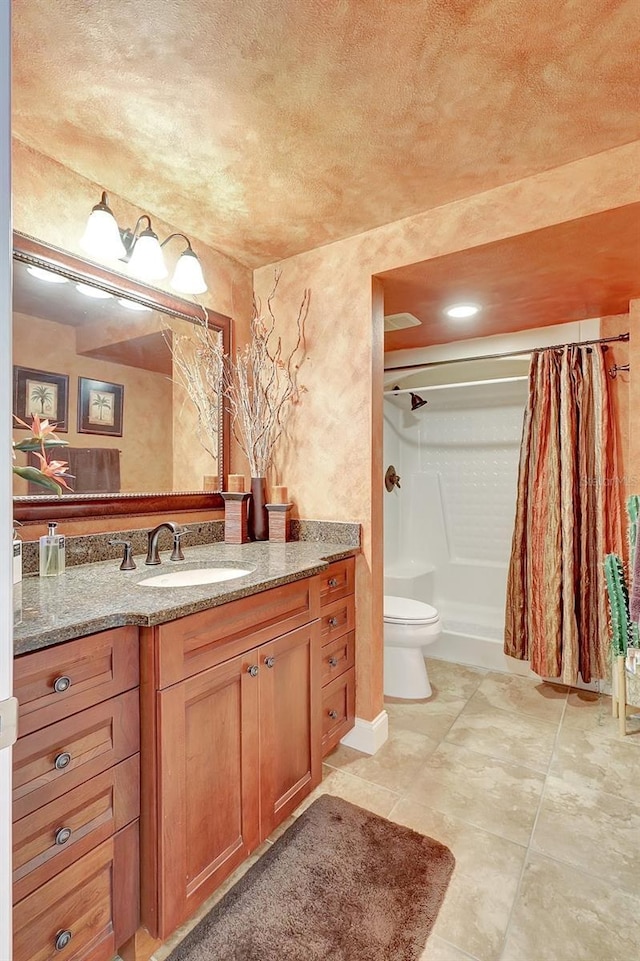 bathroom featuring a shower with curtain, tile patterned floors, vanity, and toilet
