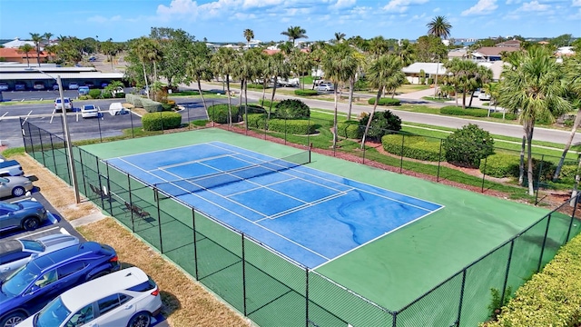 view of sport court featuring fence
