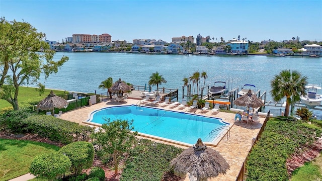 pool featuring a boat dock, boat lift, and a water view