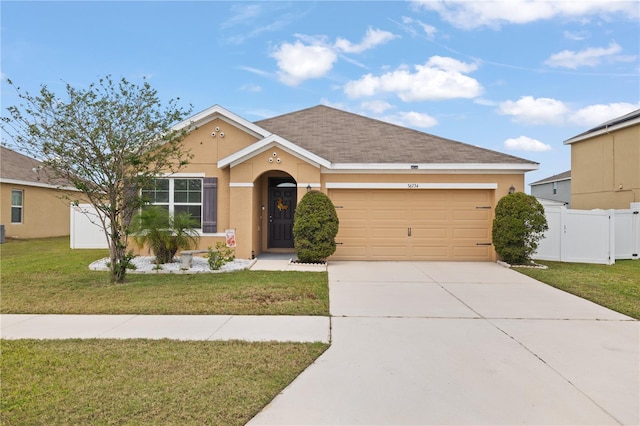 single story home with an attached garage, stucco siding, a front lawn, a gate, and driveway