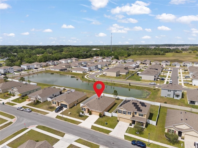 birds eye view of property featuring a water view and a residential view
