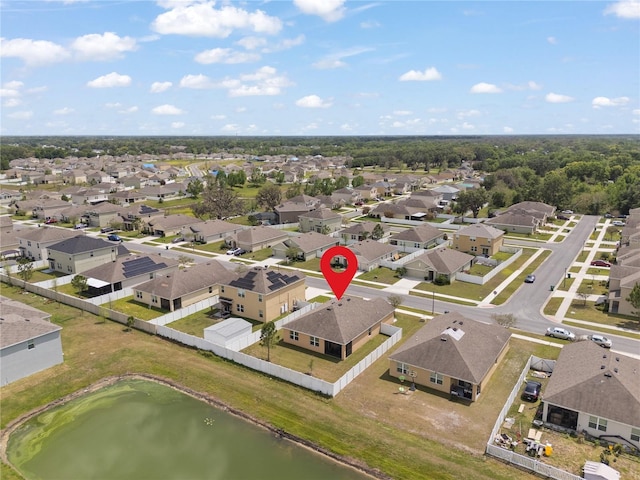 bird's eye view featuring a water view and a residential view