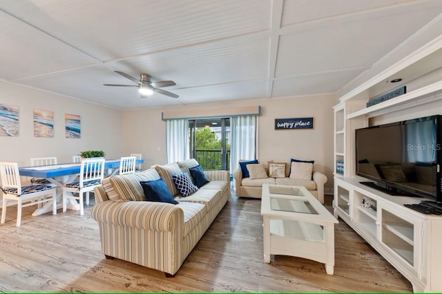 living room featuring a ceiling fan and wood finished floors