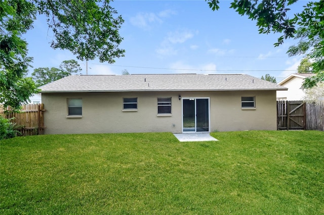 7338 Coventry Dr, Port Richey, FL 34668 - back of house featuring stucco siding, a gate, and roof with shingles