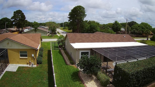 7944 Royal Hart Dr, New Port Richey, FL 34653 - rear view of house featuring a yard and stucco siding