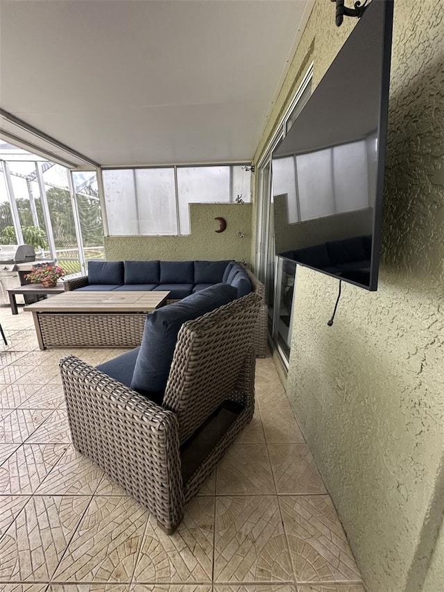 sunroom featuring outdoor lounge area