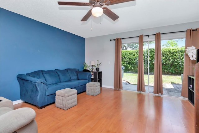 14053 Notreville Way, Tampa, FL 33624 - living area featuring baseboards, wood finished floors, and a ceiling fan