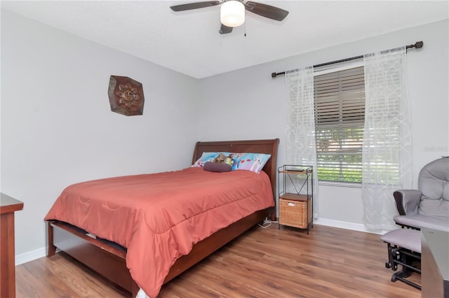 14053 Notreville Way, Tampa, FL 33624 - bedroom featuring baseboards, ceiling fan, and wood finished floors
