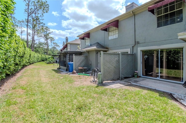 14053 Notreville Way, Tampa, FL 33624 - view of yard with central air condition unit