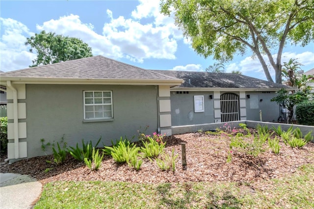 14053 Notreville Way, Tampa, FL 33624 - ranch-style house with stucco siding and a shingled roof
