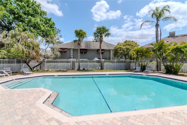 14053 Notreville Way, Tampa, FL 33624 - community pool featuring a patio and fence