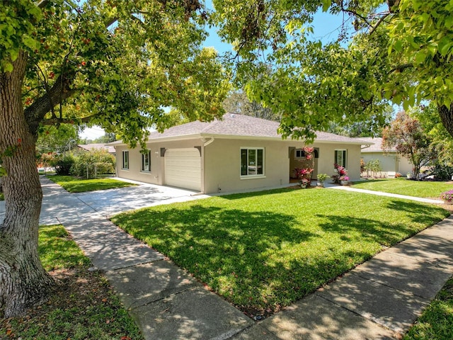 ranch-style house featuring concrete driveway, stucco siding, roof with shingles, a front lawn, and a garage