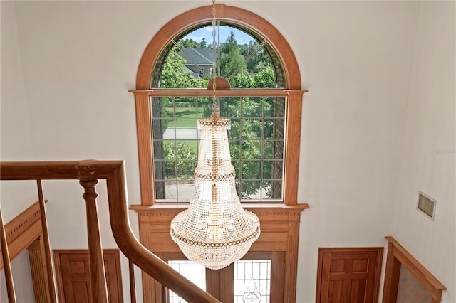 room details featuring a chandelier and visible vents