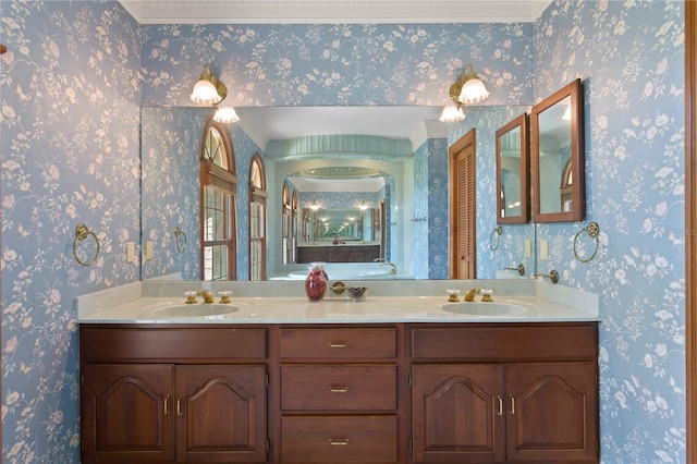 full bathroom with a sink and double vanity