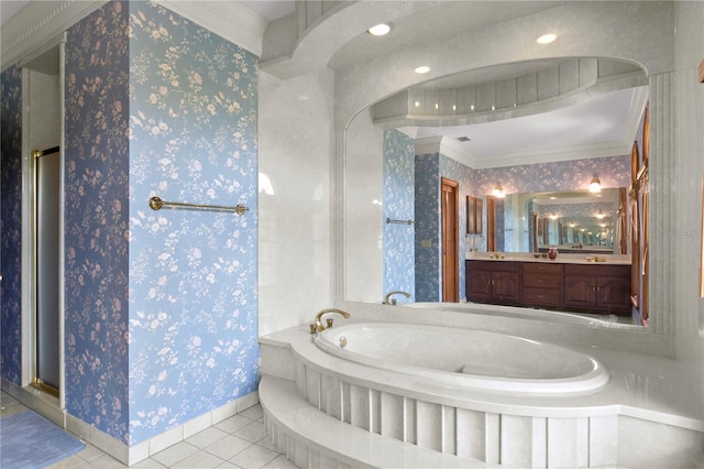 bathroom featuring tile patterned floors, baseboards, vanity, and a garden tub