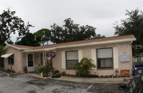 1733 Grand Blvd, Holiday, FL 34690 - view of single story home