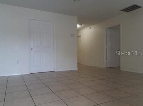 1733 Grand Blvd, Holiday, FL 34690 - spare room featuring visible vents and light tile patterned flooring