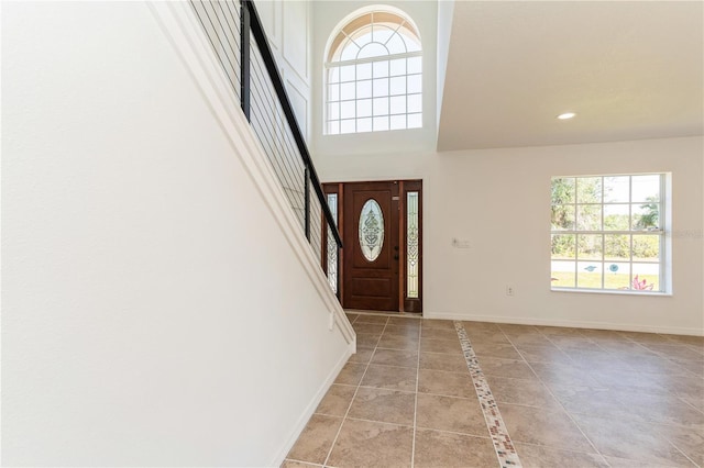 14319 Morristown Ave, Port Charlotte, FL 33981 - foyer entrance featuring baseboards, recessed lighting, stairs, and a high ceiling
