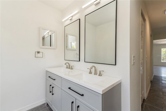 14319 Morristown Ave, Port Charlotte, FL 33981 - bathroom with baseboards, tile patterned floors, and double vanity