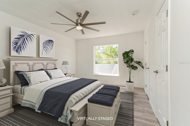 14319 Morristown Ave, Port Charlotte, FL 33981 - bedroom with wood finished floors, a ceiling fan, and baseboards