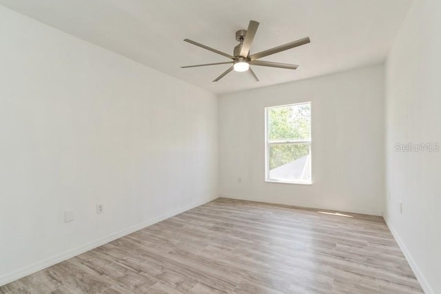 14319 Morristown Ave, Port Charlotte, FL 33981 - empty room featuring a ceiling fan, light wood-type flooring, and baseboards