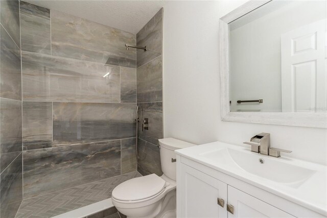 14319 Morristown Ave, Port Charlotte, FL 33981 - bathroom with toilet, a tile shower, and vanity