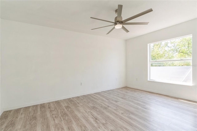 14319 Morristown Ave, Port Charlotte, FL 33981 - empty room with light wood-style floors, ceiling fan, and baseboards