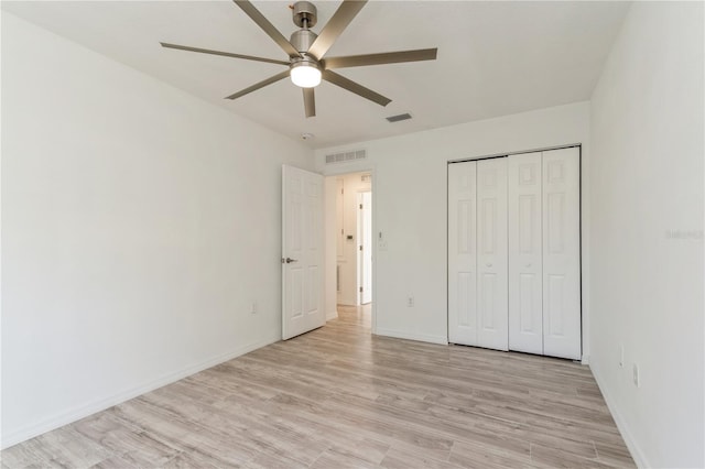 14319 Morristown Ave, Port Charlotte, FL 33981 - unfurnished bedroom featuring light wood-style floors, baseboards, a closet, and ceiling fan