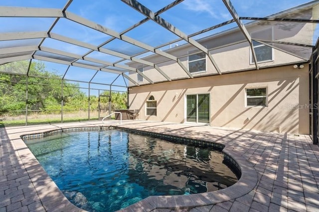 14319 Morristown Ave, Port Charlotte, FL 33981 - swimming pool featuring a patio area and glass enclosure