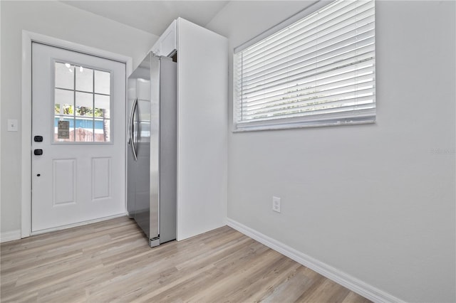 7139 Adare Dr, New Port Richey, FL 34653 - entryway with light wood finished floors and baseboards