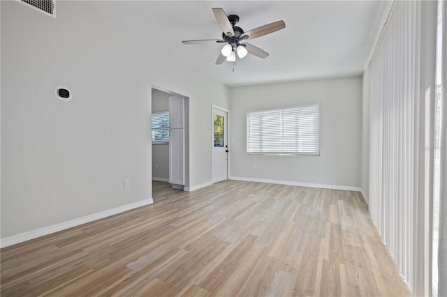 7139 Adare Dr, New Port Richey, FL 34653 - spare room featuring visible vents, baseboards, light wood finished floors, and ceiling fan