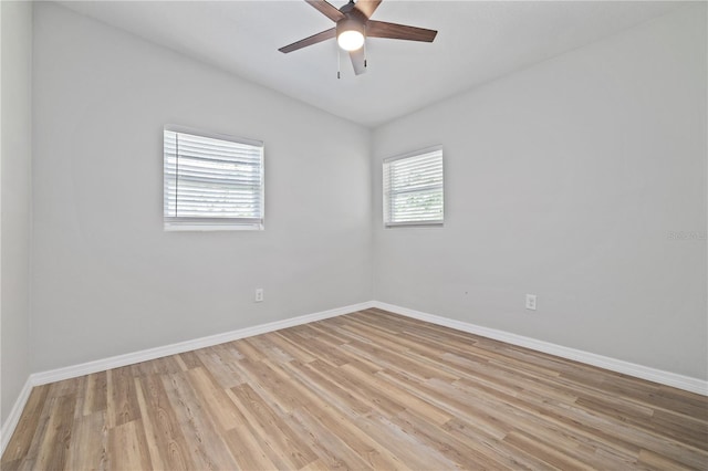 7139 Adare Dr, New Port Richey, FL 34653 - empty room featuring light wood finished floors, baseboards, lofted ceiling, and ceiling fan