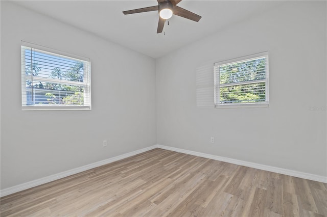 7139 Adare Dr, New Port Richey, FL 34653 - unfurnished room featuring light wood finished floors, baseboards, and a ceiling fan