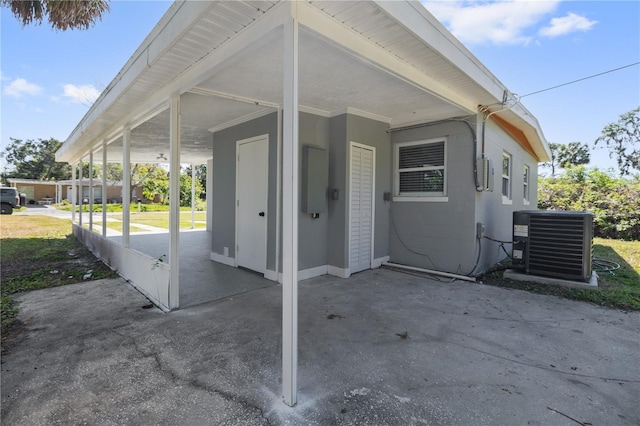 7139 Adare Dr, New Port Richey, FL 34653 - view of patio / terrace featuring an attached carport and cooling unit