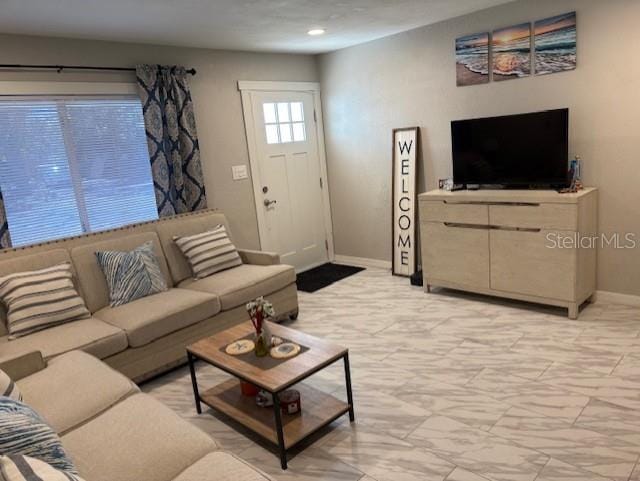 1408 San Juan Ct, Clearwater, FL 33756 - living area featuring baseboards, light marble finish floors, and recessed lighting